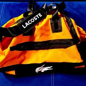 Unisex Orange & Black Lacoste Duffle Bag. No tears or rips. Mint Condition